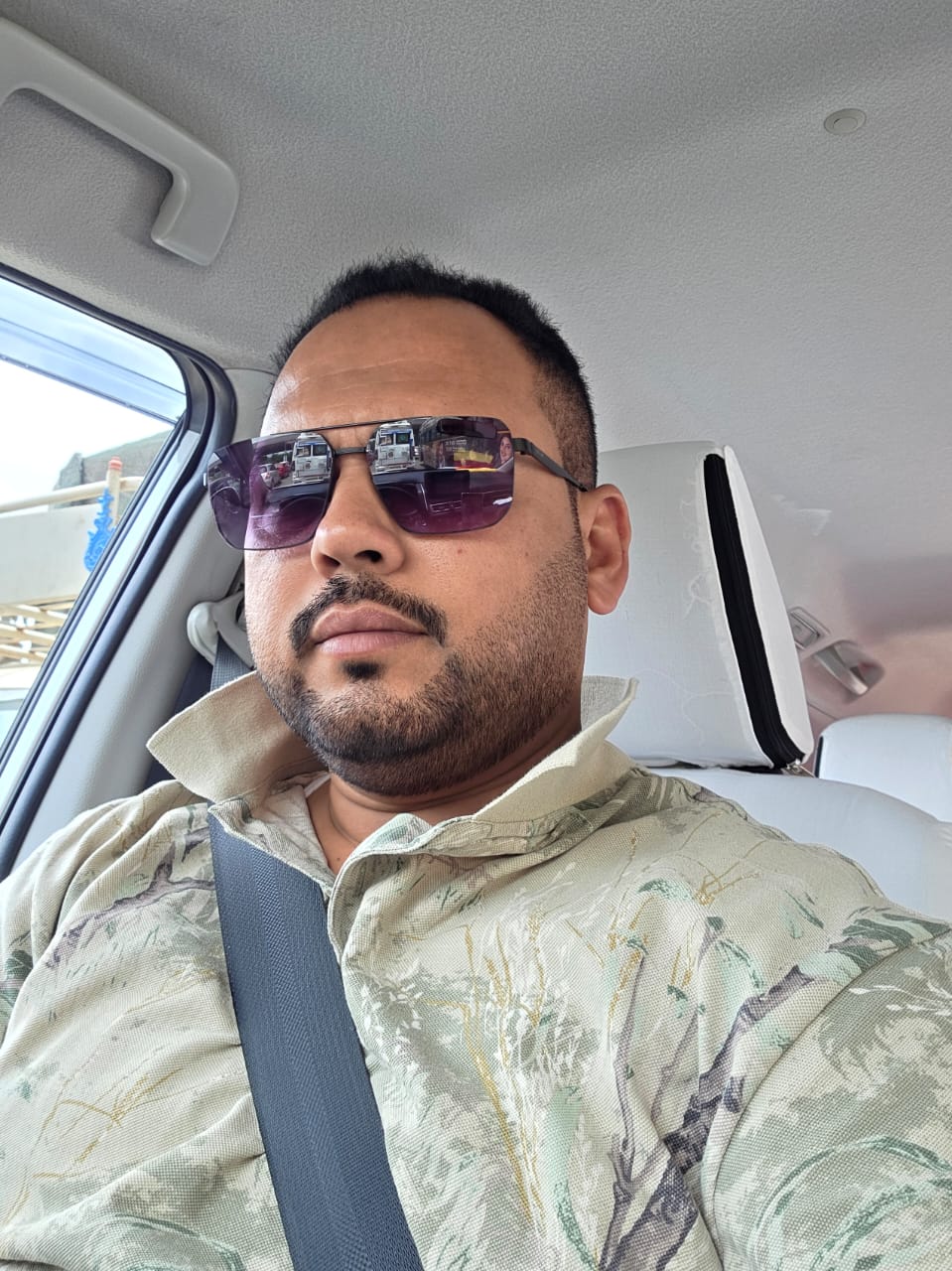 Shajid Mohammed at the wheel of his car